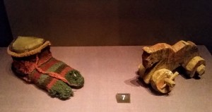 Roman Egypt: child's stripy wooden sock (3rd -4th c. AD) and a wooden toy horse (1st-3rd c. AD). The British Museum. Photo by Medievalists.net